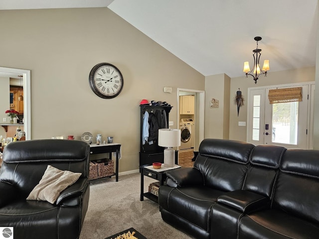 living room with a notable chandelier, high vaulted ceiling, light carpet, washer / dryer, and baseboards