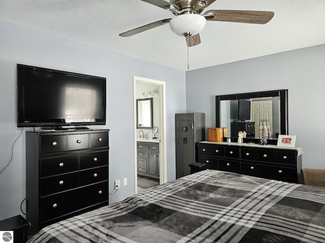 bedroom with a textured ceiling, a ceiling fan, and ensuite bathroom