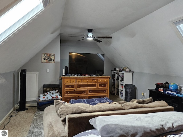 carpeted bedroom featuring baseboards, vaulted ceiling, and a ceiling fan