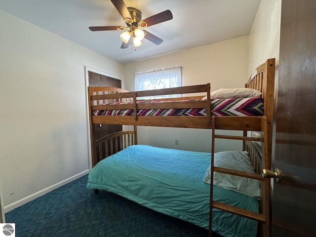 carpeted bedroom with a ceiling fan and baseboards