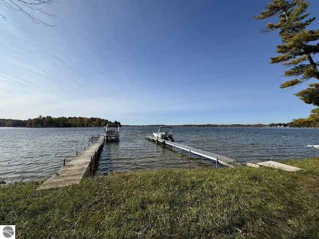 view of dock featuring a water view and boat lift