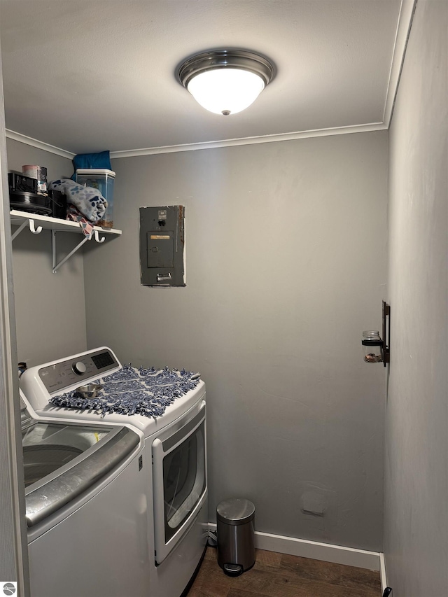 laundry area with laundry area, ornamental molding, electric panel, and washer and dryer