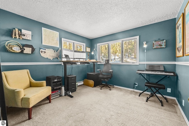 carpeted office with a textured ceiling and baseboards