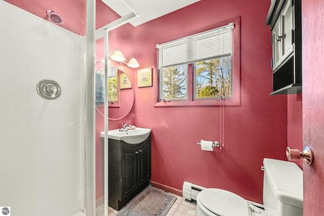 full bath with a baseboard heating unit, a shower, vanity, and toilet