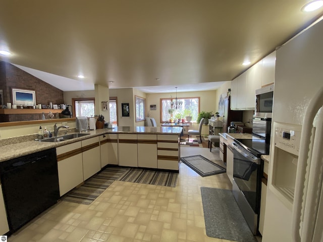 kitchen with appliances with stainless steel finishes, plenty of natural light, a sink, and recessed lighting