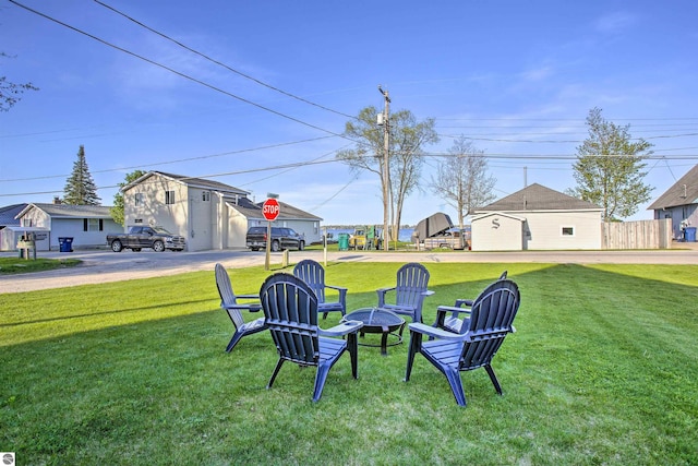 view of yard with an outdoor fire pit