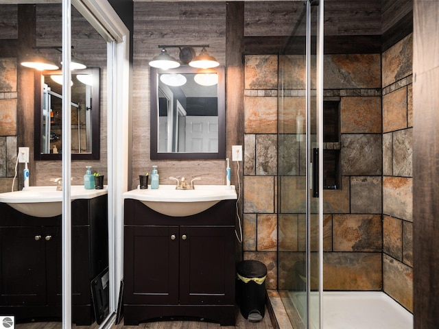 bathroom with a stall shower and vanity