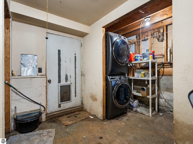 4891 Fell Dr, Marion, MI 49665 - washroom featuring stacked washer / dryer