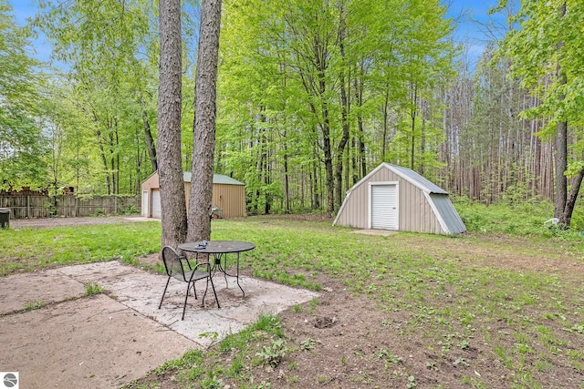 4891 Fell Dr, Marion, MI 49665 - view of yard with an outbuilding and a garage