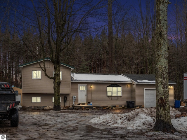 split level home with an attached garage