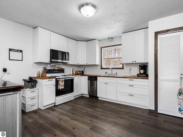 kitchen featuring stainless steel appliances, dark wood-type flooring, wood counters, and white cabinetry