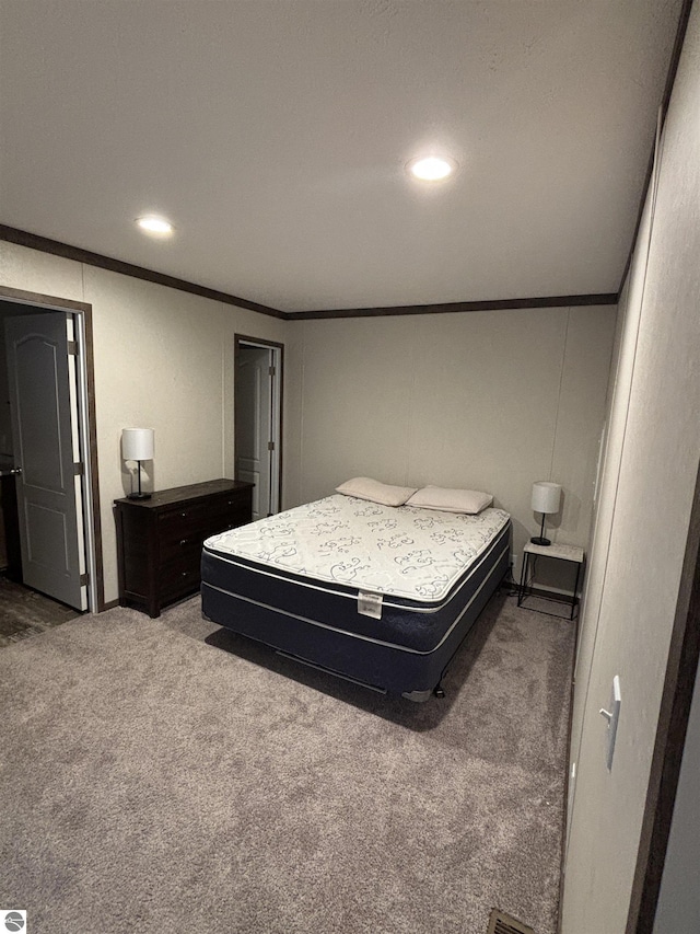 carpeted bedroom with recessed lighting and crown molding