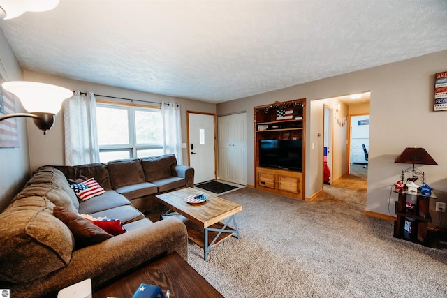 carpeted living room with baseboards and a textured ceiling