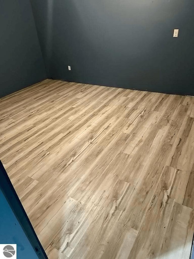 unfurnished room featuring wood finished floors