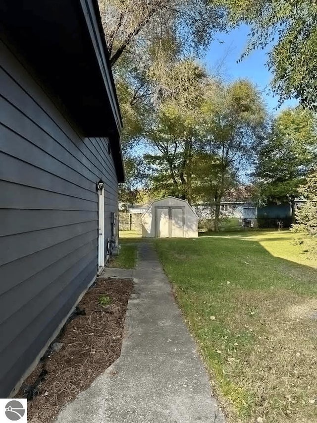 view of property exterior featuring an outbuilding, a shed, and a lawn