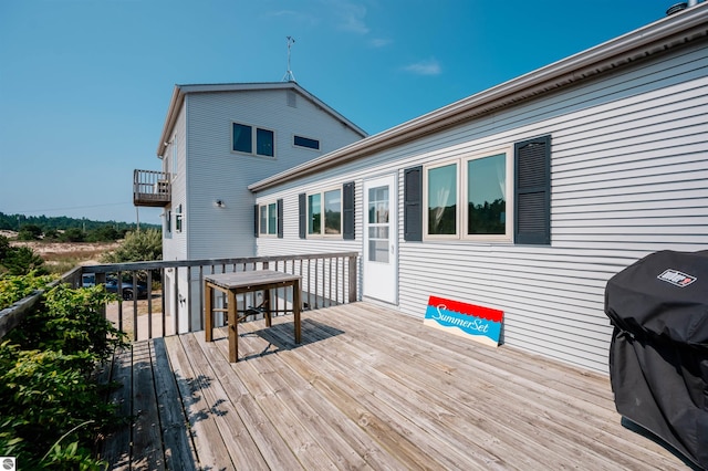 wooden deck with grilling area