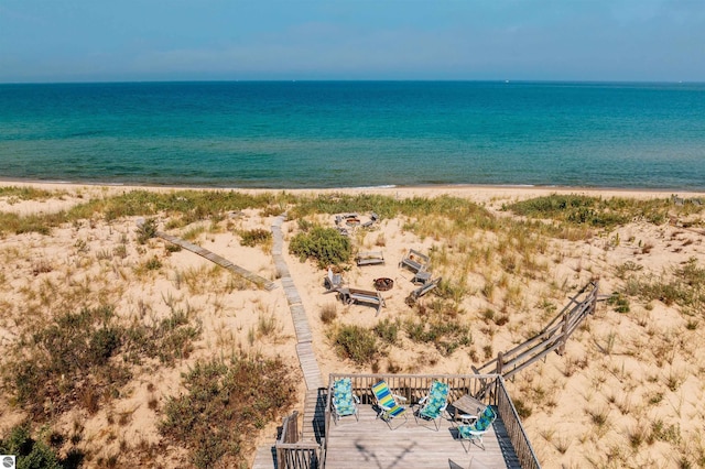 exterior space featuring a view of the beach and a water view