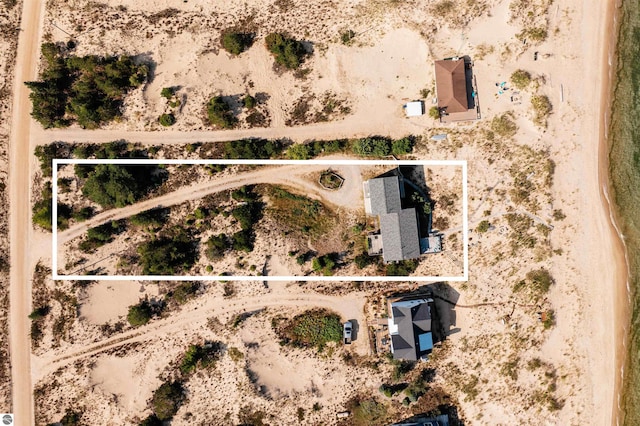 birds eye view of property with a desert view