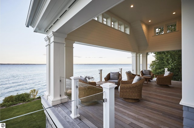 wooden deck featuring a water view