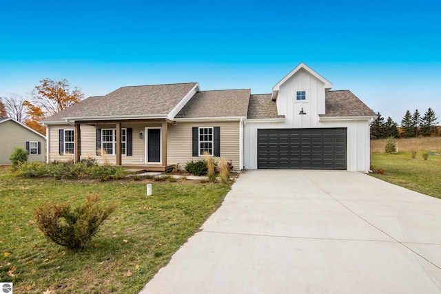 view of front of home with a front lawn, roof with shingles, board and batten siding, concrete driveway, and a garage