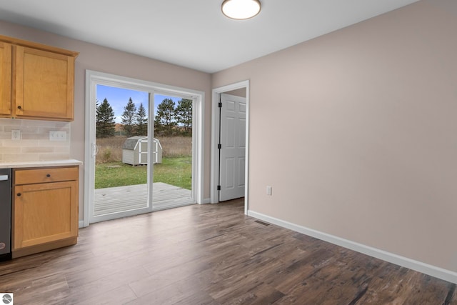 interior space featuring visible vents, baseboards, and wood finished floors