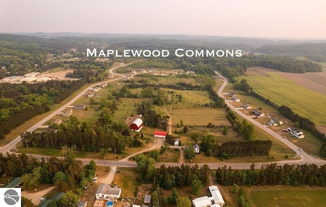 birds eye view of property featuring a rural view