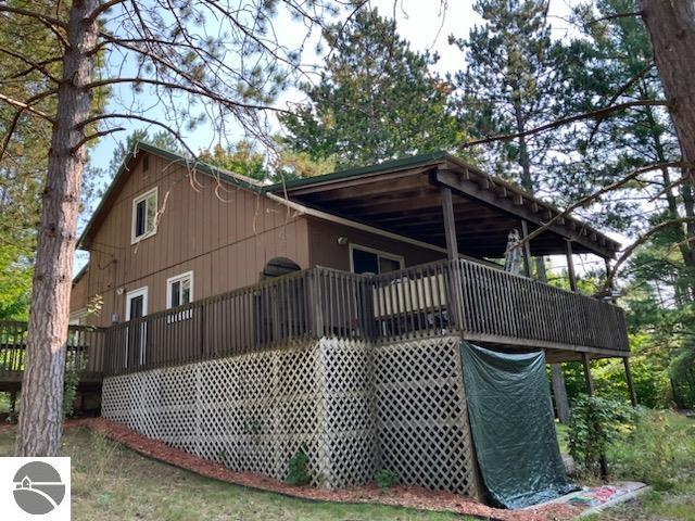 view of property exterior with a deck