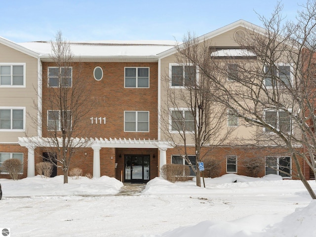 view of snow covered property