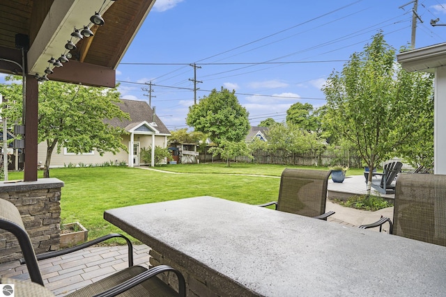 view of patio featuring fence