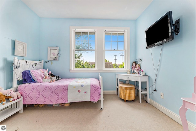 bedroom with carpet flooring and baseboards