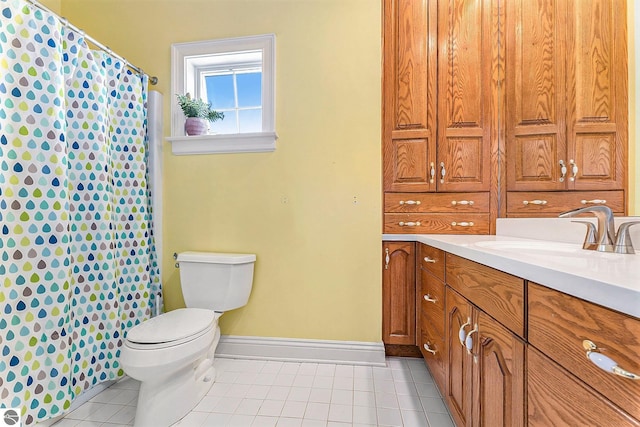 full bath with a shower with curtain, toilet, tile patterned flooring, baseboards, and vanity