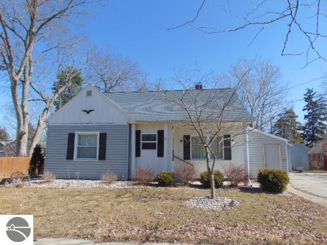 view of front of home featuring a front lawn and board and batten siding