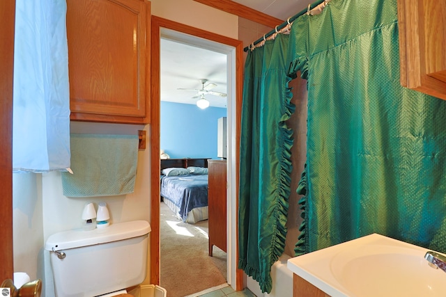 full bathroom featuring a shower with shower curtain, ensuite bath, a sink, ceiling fan, and toilet