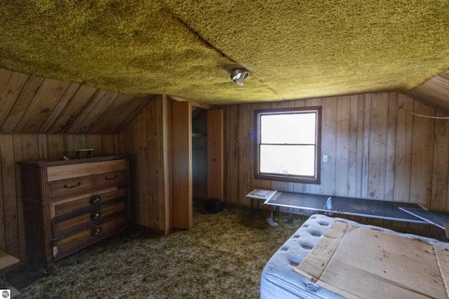 bonus room featuring wooden walls, carpet flooring, and lofted ceiling