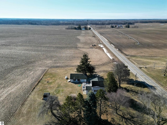 birds eye view of property with a rural view