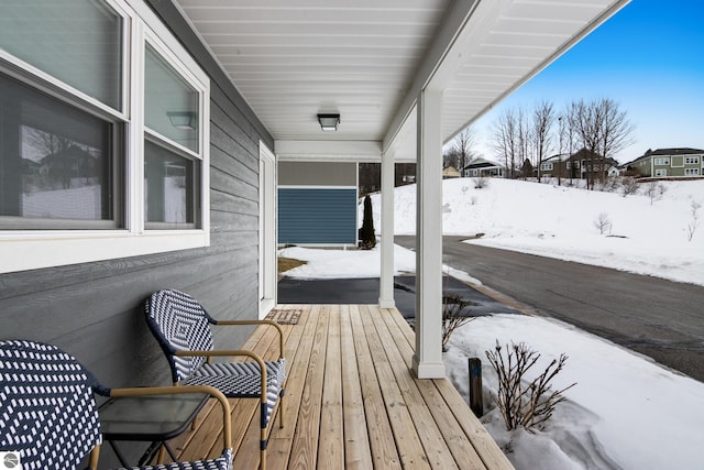 view of snow covered deck