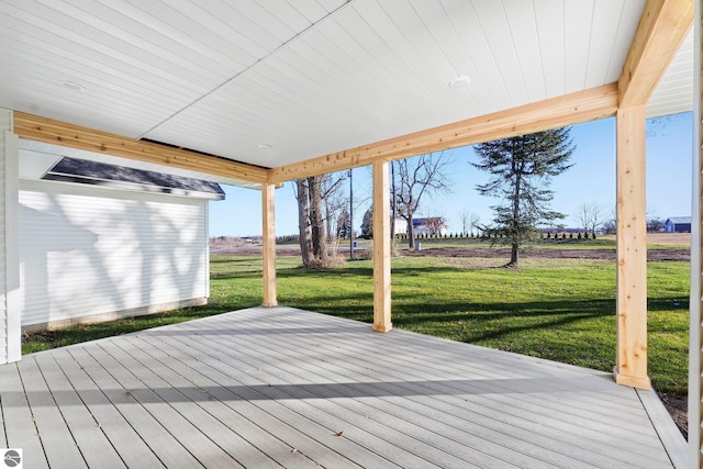 wooden terrace with a lawn