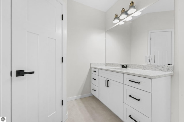 bathroom featuring vanity and baseboards