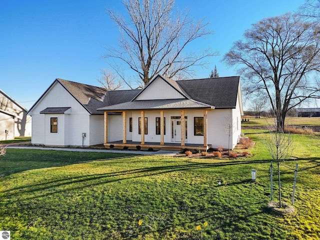 modern inspired farmhouse with a porch and a front lawn