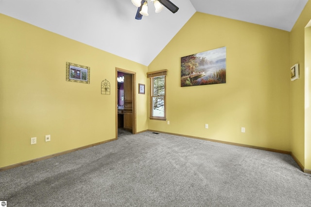 carpeted spare room featuring baseboards, high vaulted ceiling, and ceiling fan