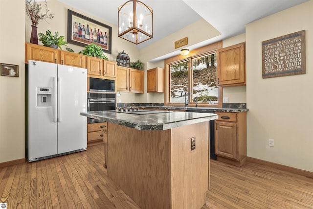 kitchen with stainless steel microwave, a center island, wall oven, light wood-style floors, and white fridge with ice dispenser