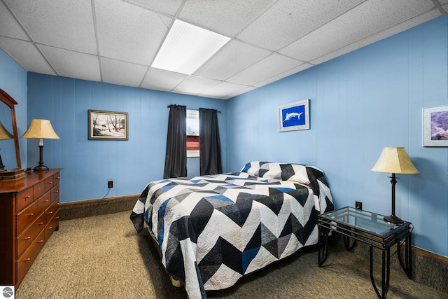 carpeted bedroom featuring a paneled ceiling