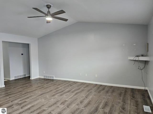 empty room with baseboards, wood finished floors, visible vents, and ceiling fan