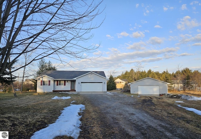 single story home with a detached garage