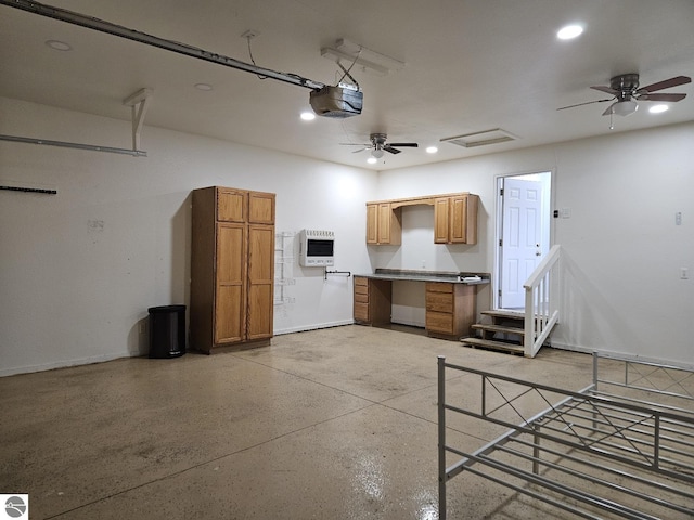 garage with heating unit, baseboards, recessed lighting, ceiling fan, and a garage door opener