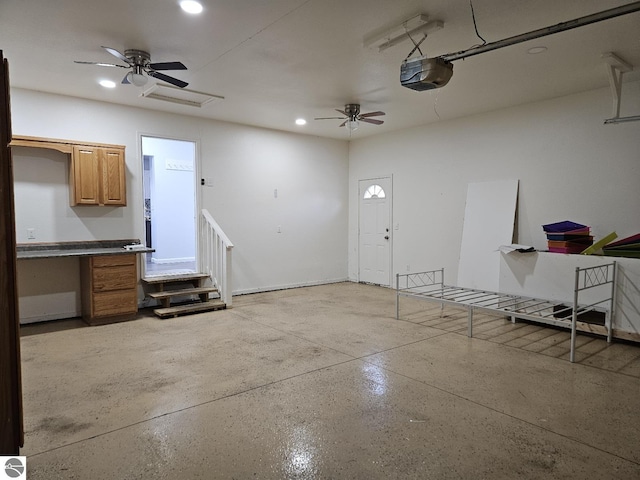 garage featuring recessed lighting, a garage door opener, and ceiling fan