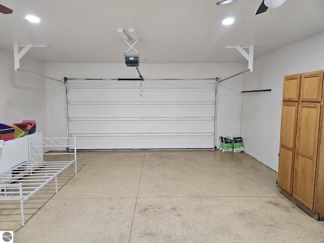 garage with recessed lighting, a garage door opener, and ceiling fan