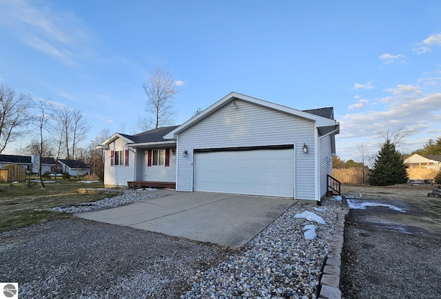 single story home featuring an attached garage and driveway