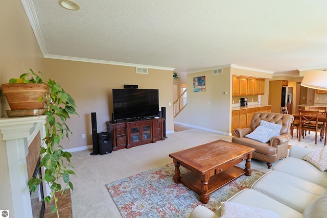 living area featuring visible vents, light colored carpet, a textured ceiling, and baseboards