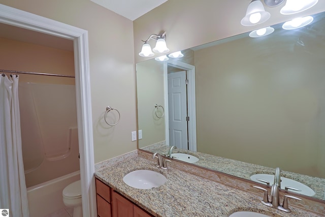 full bathroom with double vanity, shower / tub combo, toilet, and a sink